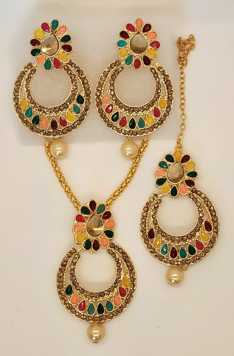 Jewelry set with gold necklace and earrings on a white background