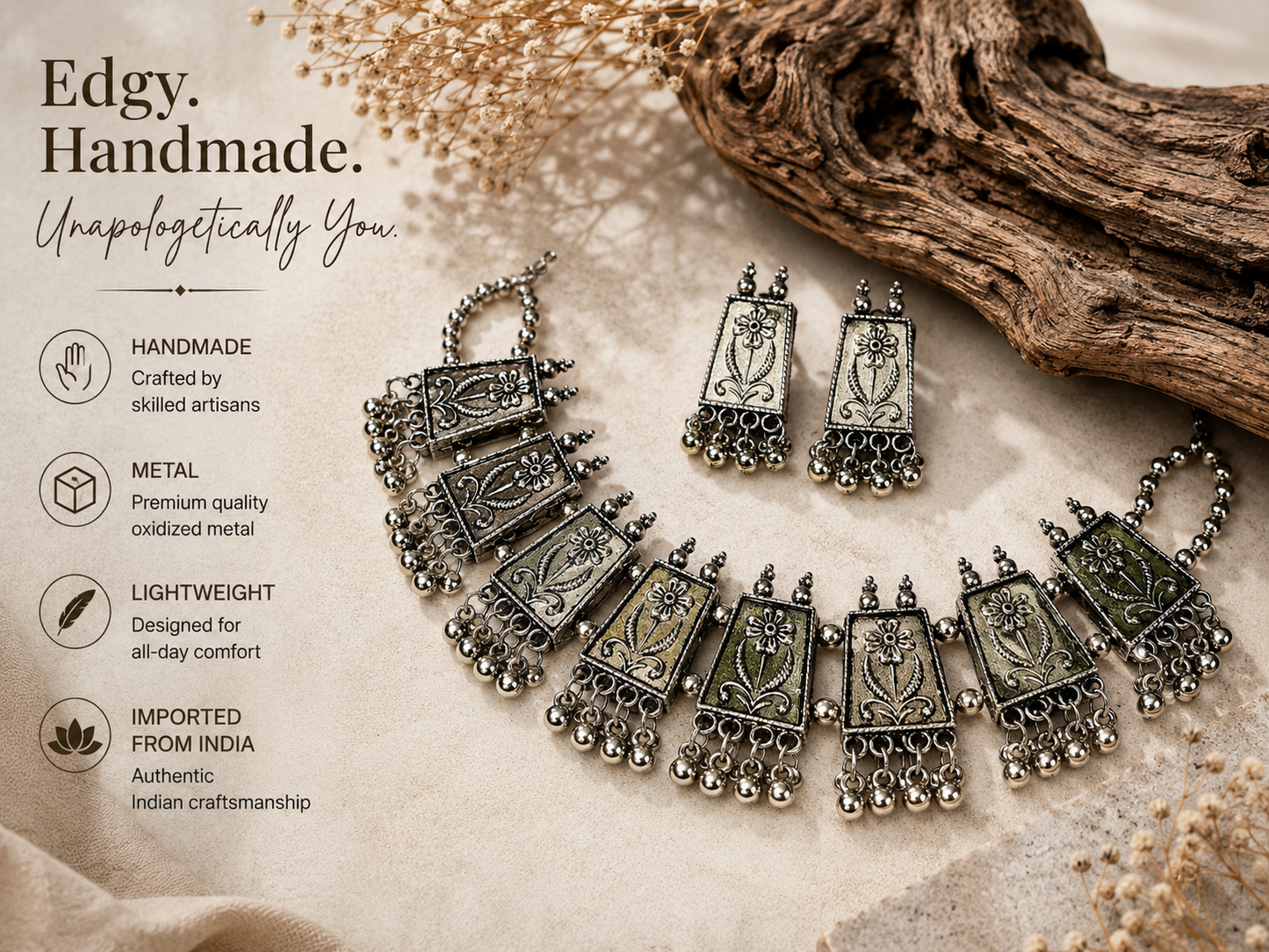 A handmade silver-toned Indian-style necklace and matching earrings displayed on a textured beige fabric with dried floral accents and a piece of driftwood. The left side features marketing text highlighting the product's handcrafted quality, premium metal, lightweight design, and authentic Indian origin.