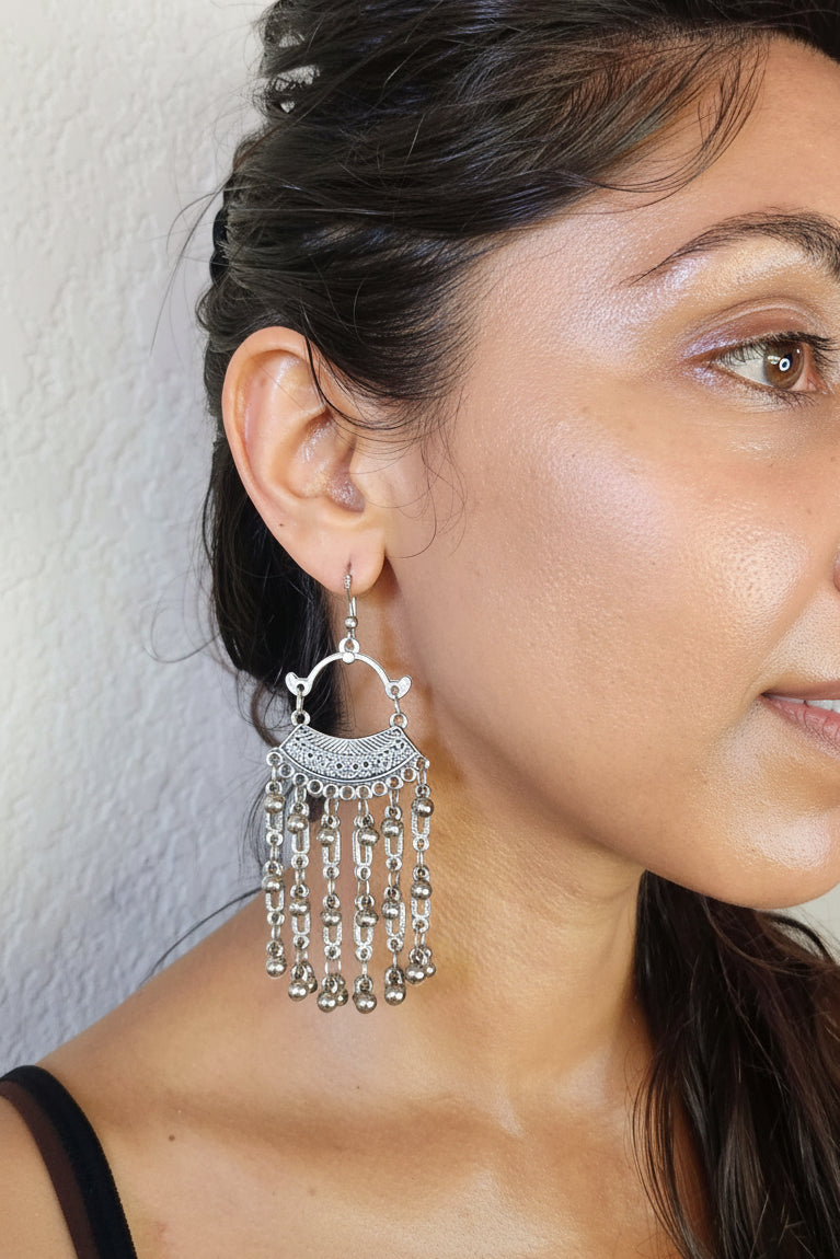 model wearing beautiful chandelier earrings