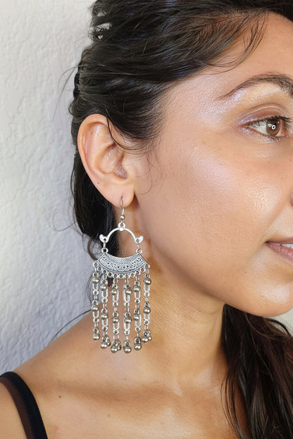 model wearing beautiful chandelier earrings