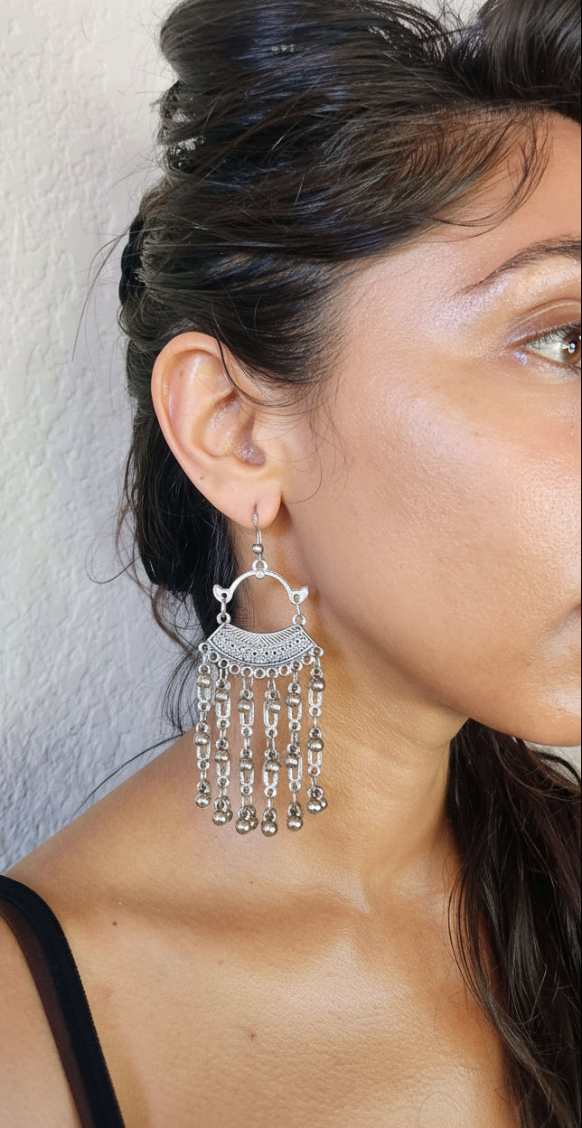 model wearing lovely chandelier earrings
