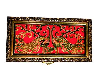 Decorative box with gold and red design on a white background