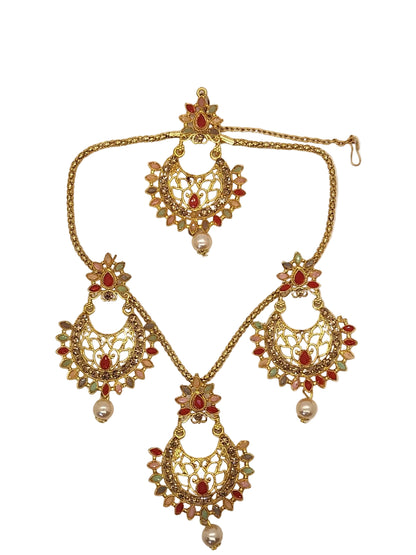 Ornate gold necklace with red and green stones on a white background
